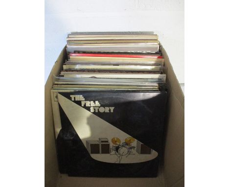 A large collection of 12" vinyl records including Queen, David Bowie, Rolling Stones, The Eagles, Bruce Springsteen, Rod Stew