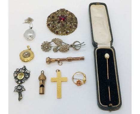 A small collection of jewellery etc. including a 9ct white gold locket and chain ( 1.6g) a 9ct stick pin, gold coloured cross