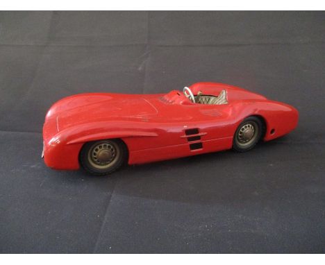 A vintage Mercedes tin plate wind up open wheel racer model car, made in Western Germany.   