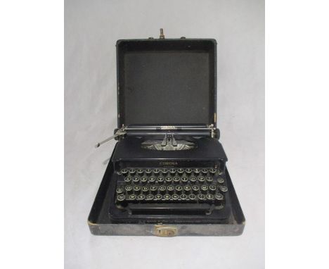 A vintage Corona Standard typewriter in carry case