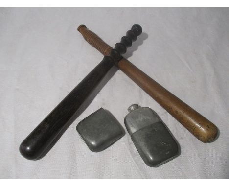 Two wooden truncheons along with a flask