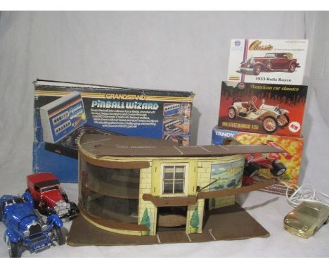 A collection of toys including a Grandstand Pinball Wizard game (no AC adaptor), a Burago unboxed 1934 Bugatti 1:18 scale, a 