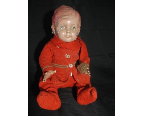 A vintage celluloid jointed doll