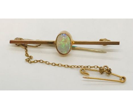 A 9ct gold bar brooch set with an opal