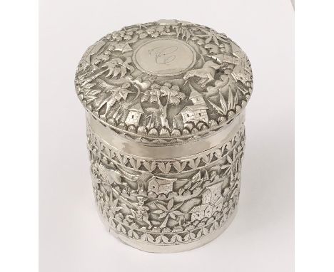 An Indian silver pot and cover decorated with hunting scenes etc.