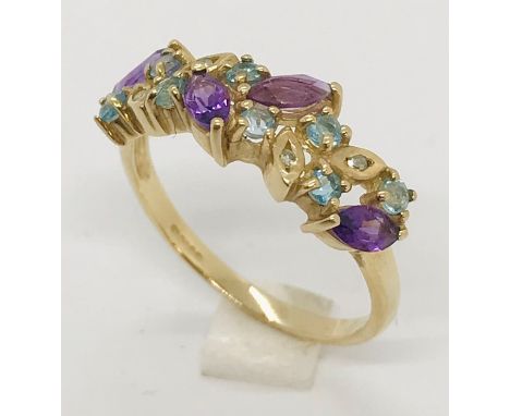 A 9ct dress ring set with amethyst &amp; blue topaz stones with diamond chips