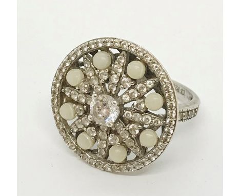 A silver dress ring set with CZ and faux pearls