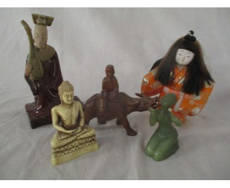 A collection of Oriental figures including a carved wooden boy on a water buffalo, Japanese pottery scholar ( signed) jade st