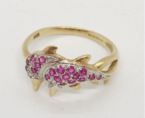 A 9ct gold gem set dolphin ring