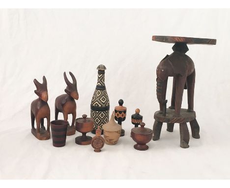 An assortment of wooden items including African influenced items, elephant stool etc.