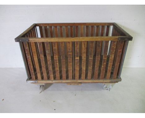 A wooden slatted bobbin trolley - length 130cm, height 91cm, width 71cm