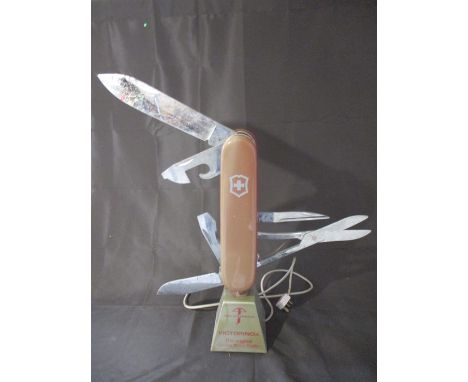 A vintage "Victorinox The Original Swiss Army knife" shop advertising display stand - front panel faded