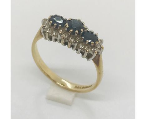 A 9 ct gold diamond and sapphire dress ring