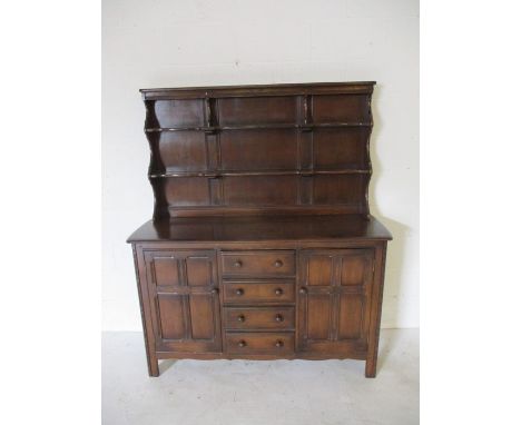 A dark wood Ercol dresser - height 170cm, width 146cm, depth 50cm