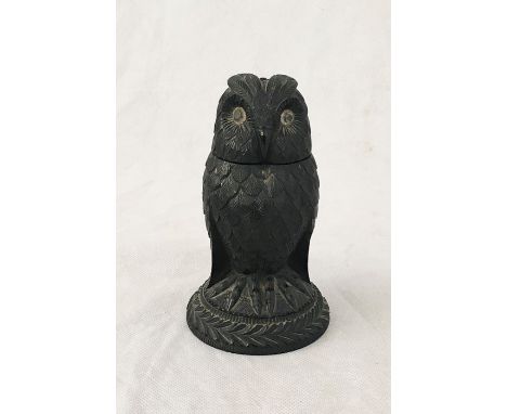 A Black Forest carved owl inkwell with glass eyes and hinged head