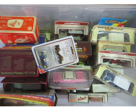 A collection of die cast including Dinky, Matchbox and Lledo. Plus a vintage Zoeller travel iron.   