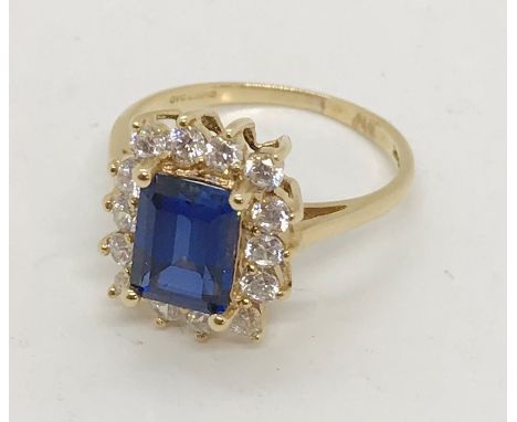 A 14ct gold sapphire and CZ cluster ring