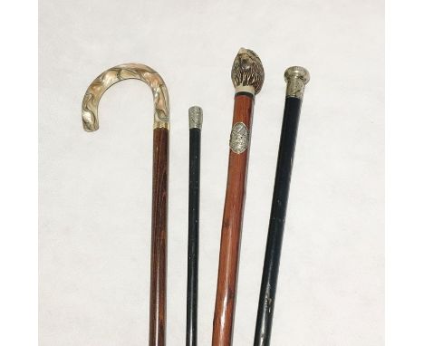 A Royal Marines Artillery swagger stick  along with a collection of walking sticks including a silver topped cane etc.