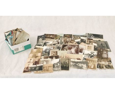 A collection of vintage photographs, postcards etc.