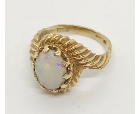 A 9ct gold ring set with an opal