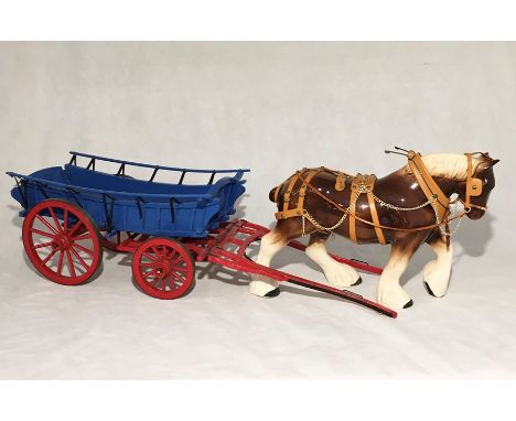 A ceramic shire horse with matching wooden cart