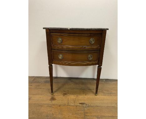A French marble topped commode, having three drawers, on square tapering legs, 64 cm wideSign of worm to top 