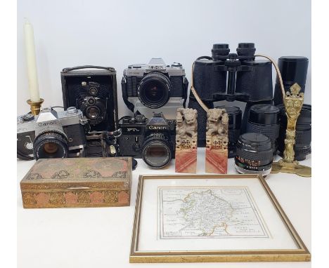 A Canon FTb SLR Camera, various lenses, a pair of binoculars, assorted prints, metalwarea, and other items (3 boxes) 