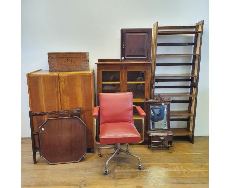 A mid 20th century oak folding desk, with two drawers revealing various compartments, 84 cm wide, a beanbag, a 1950s office c