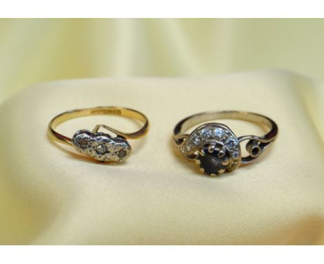 GOLD RINGS comprising 18ct gold sapphire and diamond ring together with 18ct gold and platinum three stone illusion set ring,