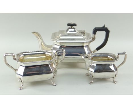 GEORGE V SILVER THREE-PIECE TEA SET, Sheffield 1926 by Cooper Bros &amp; Sons,  of canted rectangular bellied form on foliate