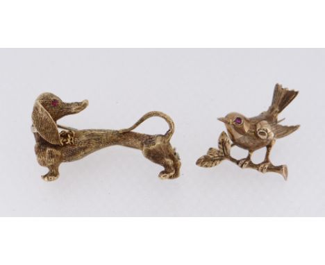 GOLD &amp; RUBY ANIMAL BAR BROOCHES comprising 18ct gold dog brooch, 9.7gms, and a 9ct gold bird brooch, 3.0gms, both set wit