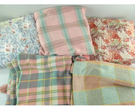 GROUP OF VINTAGE BED COVERINGS, probably Welsh, including three plaid pastel woollen rugs, and two floral printed cotton quil