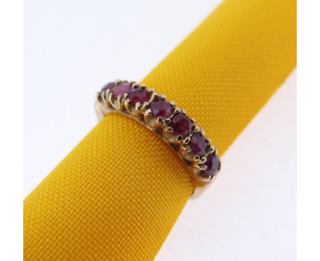 9CT GOLD SEVEN STONE RUBY RING, ring size M, 2.4gms, in W Grant of York jewellery ring box Condition: two chips to two of the