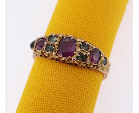 15CT GOLD EMERALD &amp; GARNET RING, scroll engraved, ring size K, 2.1gms, in square cream ring box Condition Report: appears