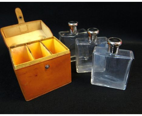 BBC BARGAIN HUNT LOT:&nbsp;VINTAGE LEATHER-CASED EAU DE TOILETTE SET, c. 1950s, containing three slim rectangular clear glass