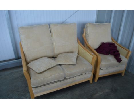 A conservatory sofa with matching armchair 