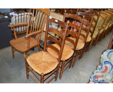 A set of four oak ladder back and rush seated chairs