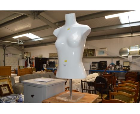 A female mannequin on stand 