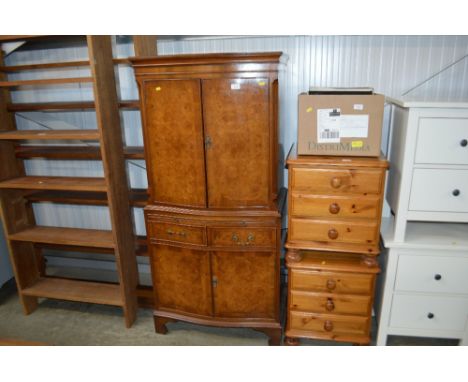 A walnut bow front drinks cabinet fitted two drawers.