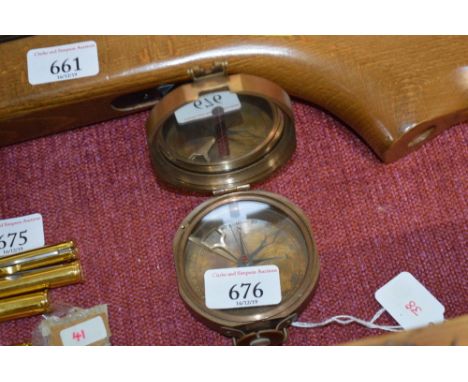 A reproduction brass cased compass (38)