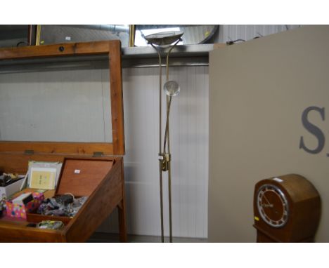 A brass standard lamp with adjustable reading lamp