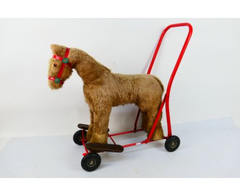 Tri-ang - A vintage Tri-ang push along Horse in Good lightly used condition.  (This does not constitute a guarantee) [ba]