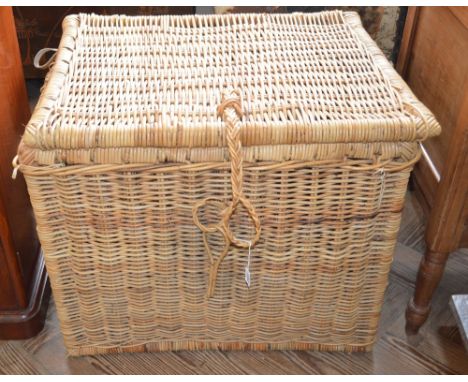 A large wicker trunk and a smaller basket