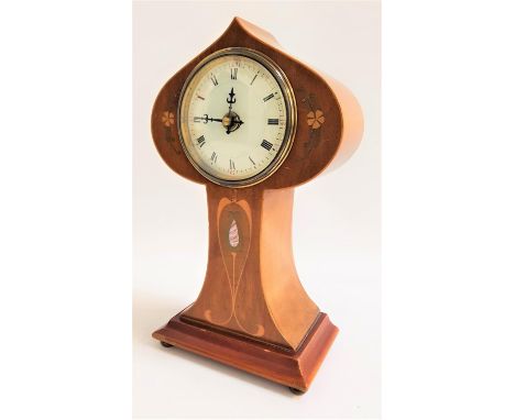ART NOUVEAU MANTLE CLOCKthe shaped mahogany case inlaid with stylised motifs with mother of pearl, a circular dial with Roman