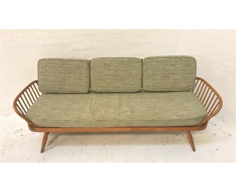 ERCOL LIGHT ELM AND BEECH SOFA/DAY BEDwith a shaped back, loose cushions and slatted spindle ends, standing on turned support