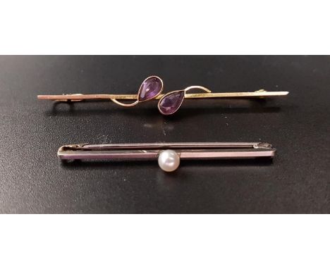 TWO NINE CARAT GOLD BAR BROOCHESone in white gold with central pearl, 4.3cm long; the other in rose and yellow gold set with 