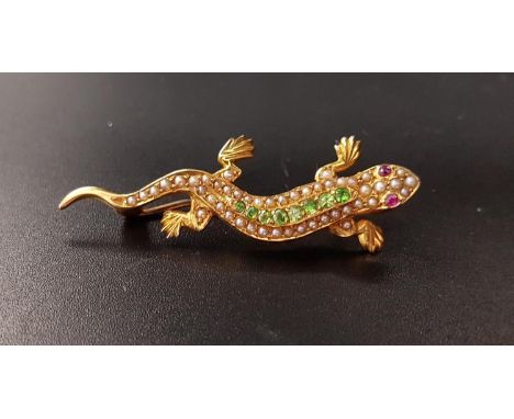 UNUSUAL GEM AND SEED PEARL SET LIZARD BROOCHwith green gemstones and seed pearls to the body and ruby eyes, in unmarked high 