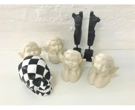 SMALL LOT OF COLLCTABLE ITEMScomprising four ceramic cherub shaped vases, a black and white harlequin decorated composition s