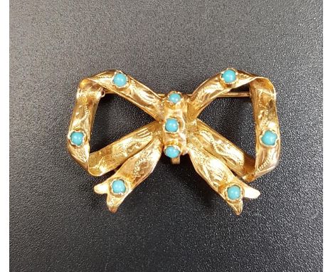 TURQUOISE SET BOW SHAPED GOLD BROOCHin unmarked high carat gold, approximately 3.3cm wide and 4.5 grams 