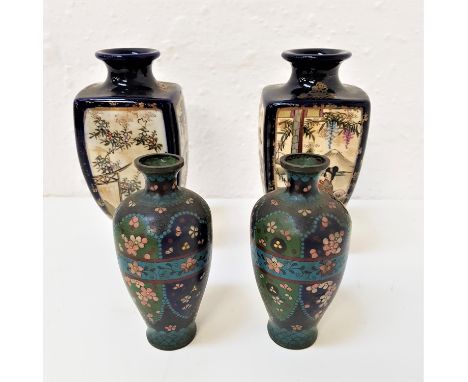 PAIR OF JAPANESE VASESraised on circular bases with four panel sides decorated with figures and plants, 21cm high, together w